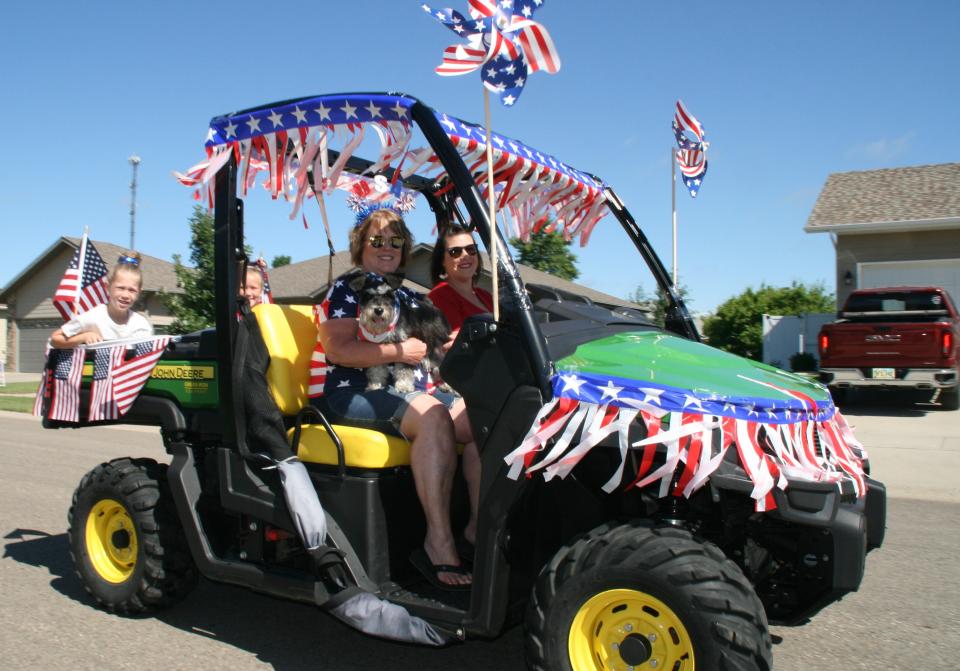 Decorated golf carts, yard tractors and all-terrain vehicles were part of the July 4 parade through the Rolling Hills Subdivision Monday morning.