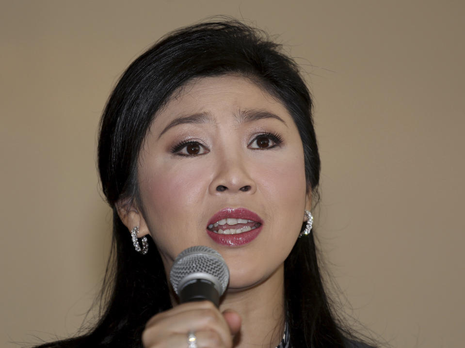 Thai Prime Minister Yingluck Shinawatra answers questions during an interview with theforeign media at the office of Permanent Secretary for Defense on the outskirts of Bangkok, Thailand, Friday, Jan. 17, 2014. Yingluck is facing fresh legal troubles after the country's anti-corruption commission announced late Thursday that it would investigate her handling of a controversial rice policy. The National Anti-Corruption Commission that it had found grounds to investigate allegations that Yingluck was criminally negligent in her handling of what the government has described as a deal to export surplus rice to China. (AP Photo/Apichart Weerawong)