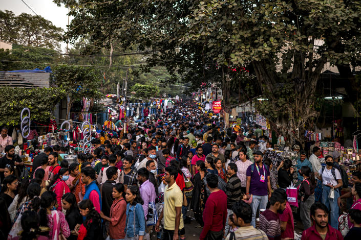 Shoppers crowd in huge numbers at a market area in New Delhi. 