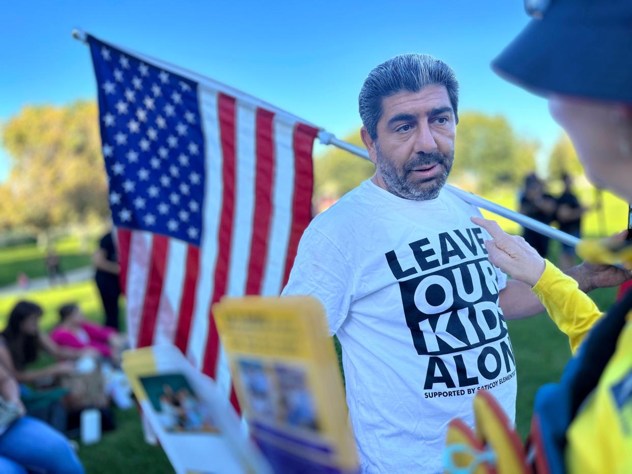Manuk Grigoryan of North Hollywood attends a parental rights rally at Rancho Madera Community Park in Simi Valley on Tuesday.
