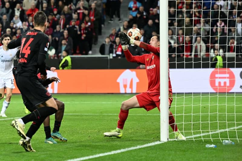 Leverkusen's Patrik Schick (L) scores his side's third goal of the game during the UEFA Europa League Round of 16, second leg soccer match between Bayer Leverkusen and FK Karabakh Agdam at the BayArena. Federico Gambarini/dpa