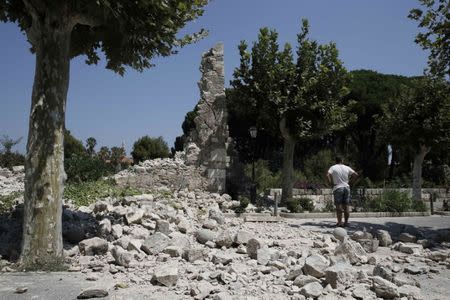 A man stands next to debris following an earthquake on the island of Kos, Greece July 21, 2017. REUTERS/Costas Baltas