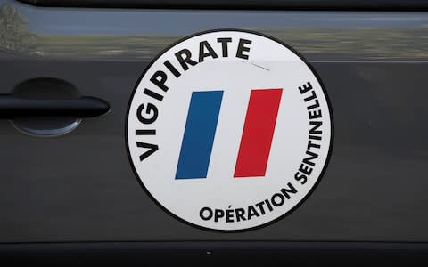 A Vigipirate logo is seen on a military van near the scene where French soliders were hit - Credit: REUTERS/Benoit Tessier