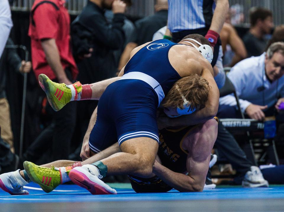 Penn State's Aaron Brooks works for the first-period pin against Wyoming’s Joseph Novak during the second round of the NCAA Wrestling Championships in Kansas City, Missouri, on Thursday, March 21, 2024.