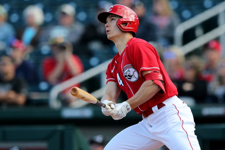 Cincinnati Reds non-roster invitee outfielder Stuart Fairchild (84) hits a two-run home run in the eighth inning during a Cactus League spring training baseball game against the Chicago White Sox, Sunday, Feb. 23, 2020, at Goodyear Ballpark in Goodyear, Ariz.