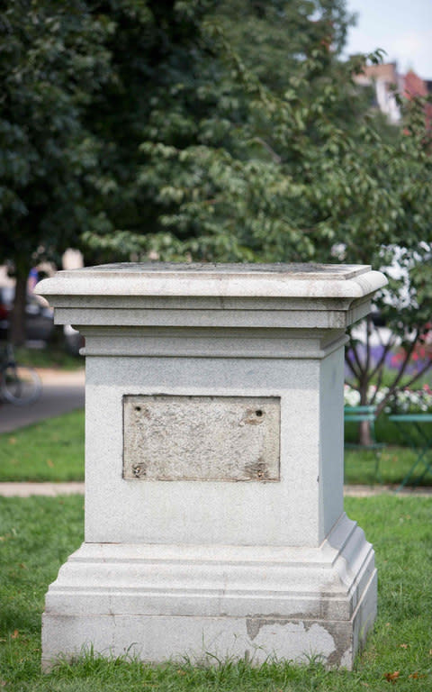 The Roger B. Taney monument base in Mount Vernon Place is viewed in Baltimore, Maryland, after it was removed by the city on August 16, 2017 - Credit: AFP