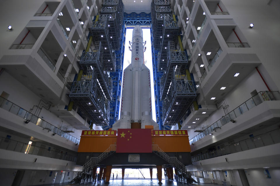 FILE - In this July 17, 2020, photo released by China's Xinhua News Agency, a Long March-5 rocket is seen at the Wenchang Space Launch Center in southern China's Hainan Province. Chinese technicians were making final preparations Monday, Nov. 23, 2020, to launch a Long March-5 rocket carrying a mission to bring back material from the lunar surface in a potentially major advance for the country's space program. (Zhang Gaoxiang/Xinhua via AP, File)