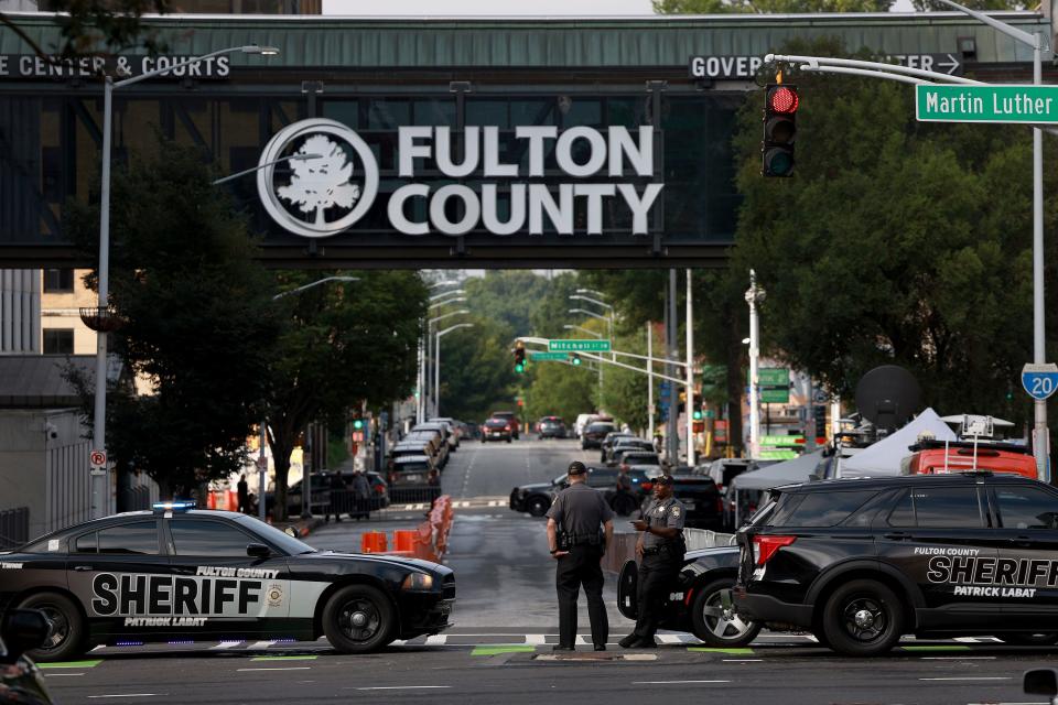 August 7, 2023: Fulton County Sheriff officers block off a street in front of the Fulton County Courthouse in Atlanta, Georgia. The heightened security is in place as Fulton County District Attorney Fani Willis is expected to announce a possible grand jury indictment in her investigation into former President Donald Trump and his Republican allies alleged attempt to overturn the 2020 election in the state.