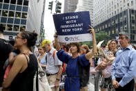 <p>Protesters carrying signs cross E. 42nd Street and head toward the United Nations in New York City on June 20, 2018. (Photo: Gordon Donovan/Yahoo News) </p>