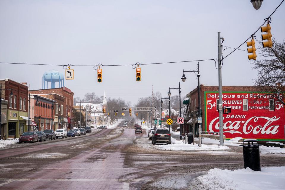 Snow falls lightly over downtown Albion, Michigan on Tuesday, Jan. 25, 2022.