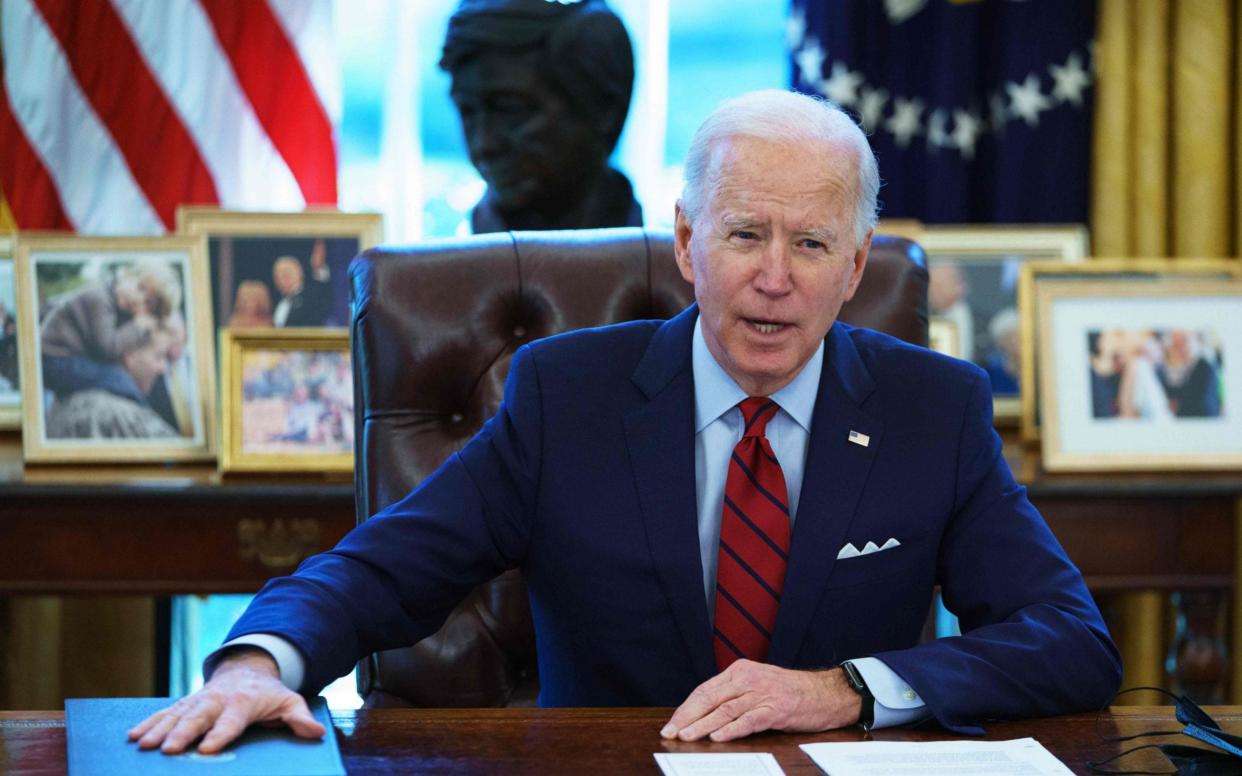 US President Joe Biden speaks before signing executive orders on health care, in the Oval Office  - MANDEL NGAN /AFP