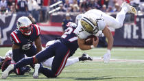 New Orleans Saints quarterback Taysom Hill (7) is taken down by New England Patriots cornerback J.C. Jackson (27) during the first half of an NFL football game, Sunday, Sept. 26, 2021, in Foxborough, Mass. (AP Photo/Mary Schwalm)