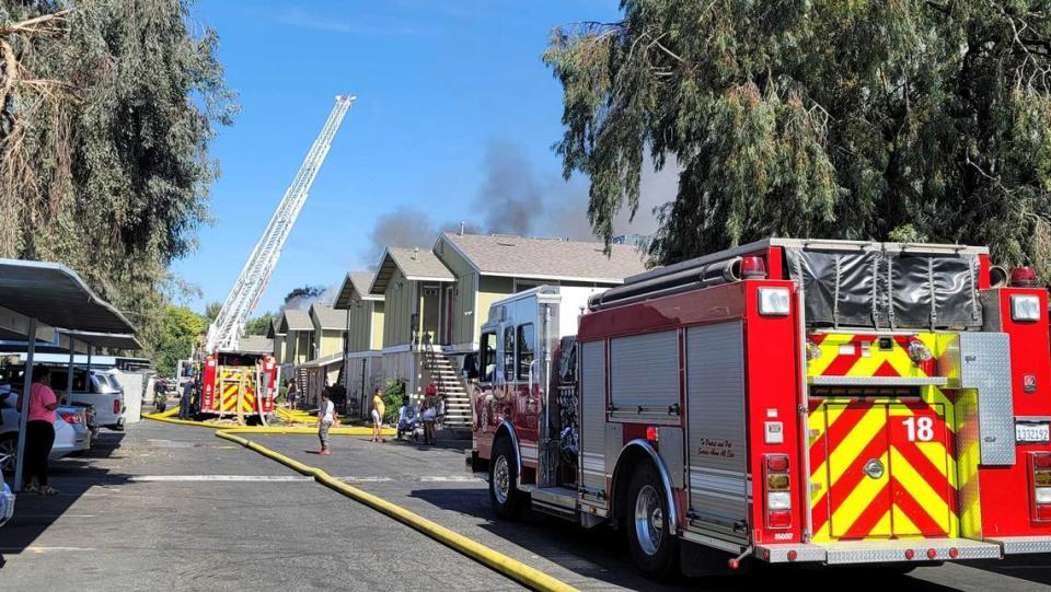 Fresno Fire Department trucks respond to a three-alarm fire at an apartment complex near Marks and Dakota avenues on Monday, May 16, 2022.