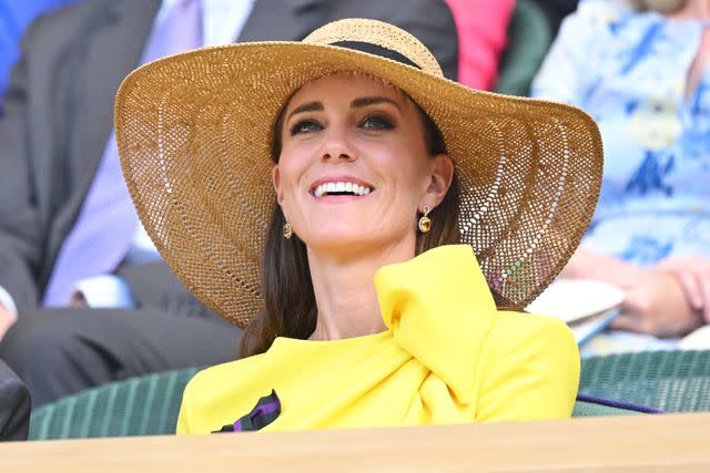<p>Karwai Tang/WireImage</p> Kate Middleton wears a hat at Wimbledon in 2022