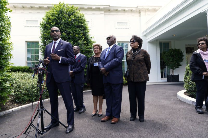 The Brown v. Board of Education plaintiffs speak to the members of the media after meeting with President Joe Biden at the White House in Washington on Thursday. Photo by Yuri Gripas/UPI