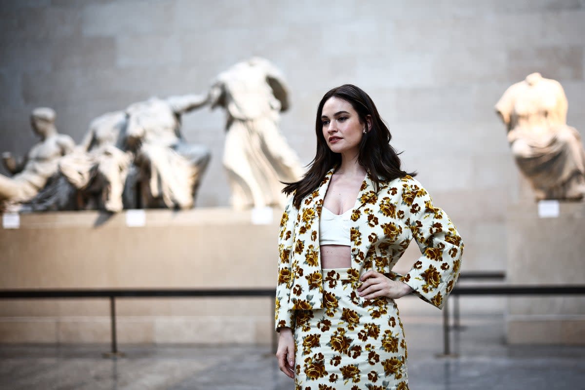 Lily James was pictured posing in front of the artefacts  (AFP/Getty)