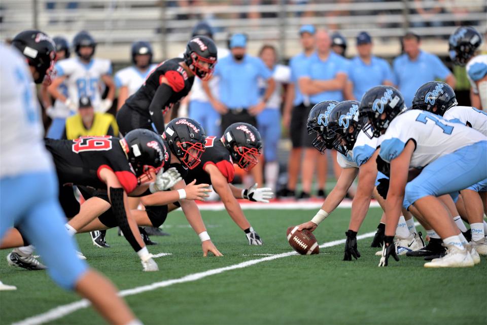 The ROCORI defensive line lines up for a play against Becker in the season opener on Friday, Aug. 26, 2022, at ROCORI High School.