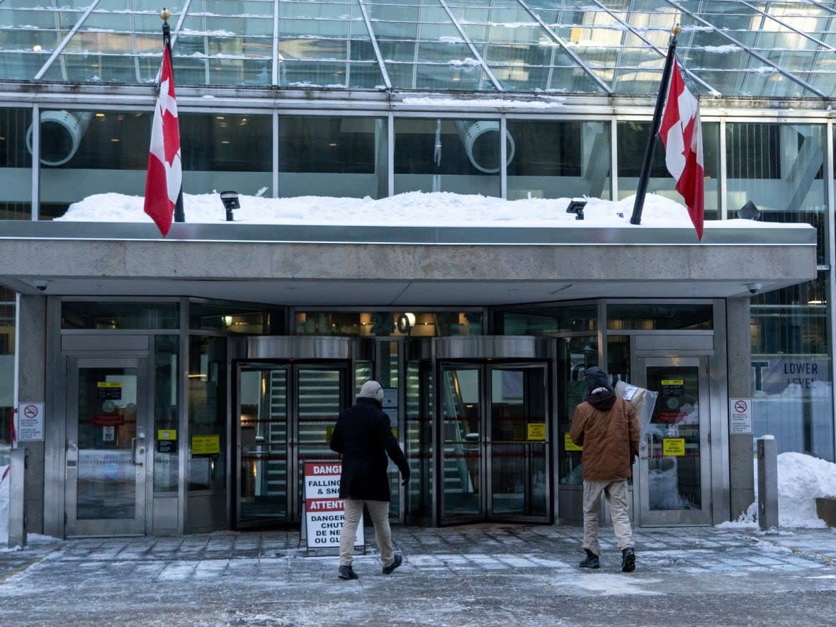 Immigration, Refugees and Citizenship Canada is housed in this building in downtown Ottawa. Several permanent residency applicants wonder why their applications have been stuck under one immigration officer, while they say others are progressing faster. (Francis Ferland/CBC - image credit)