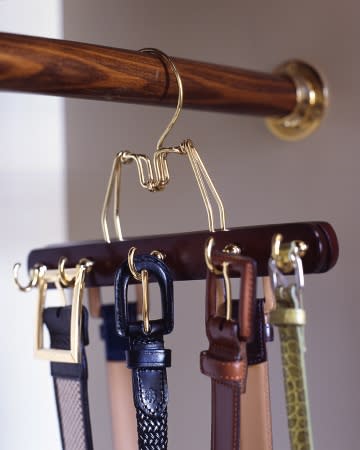 <div class="caption-credit"> Photo by: Martha Stewart Living</div><b>Matching Belt</b> <b>Rack</b> <br> To create a belt rack that matches your other hangers (and doesn't require making holes in the wall), try this: Predrill a row of holes in alternating spots on both sides of a wooden clamp hanger, and screw in cup hooks. Make as many of these hangers as you need to accommodate your belts. <br> <b>Related:</b> <br> <b><a href="http://www.marthastewart.com/275539/bedroom-decorating-ideas/@center/277006/bedroom-and-bathroom-decorating?xsc=synd_yshine" rel="nofollow noopener" target="_blank" data-ylk="slk:23 Ways to Decorate Your Bedroom;elm:context_link;itc:0" class="link ">23 Ways to Decorate Your Bedroom</a> <br> <a href="http://www.marthastewart.com/275280/bathroom-organization-tips/@center/277006/bedroom-and-bathroom-decorating?xsc=synd_yshine" rel="nofollow noopener" target="_blank" data-ylk="slk:24 Ways to Organize Your Bathroom;elm:context_link;itc:0" class="link ">24 Ways to Organize Your Bathroom</a></b> <br>