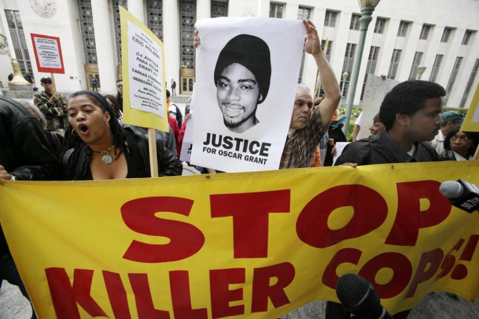 Protesters call for justice in the killing of Oscar Grant on 13 June 2011 at the US district court building in Los Angeles.