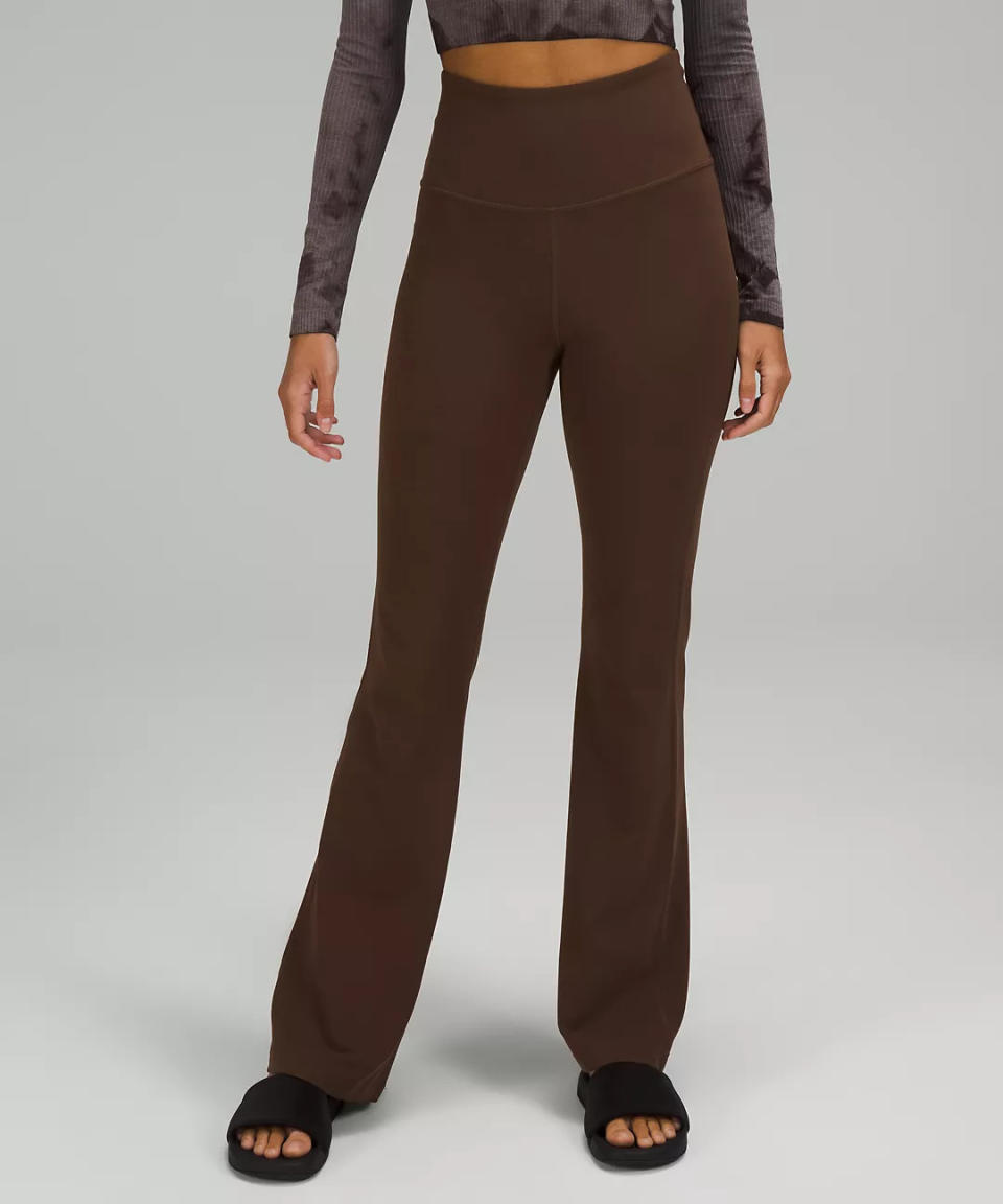 model wears brown Groove Super-High-Rise Flared Pant Nulu. Image via lululemon.