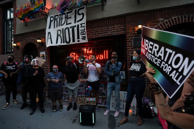 People attend a rally at the Stonewall Inn to support the Supreme Court decision to uphold LBGTQ+ workplace rights in New York