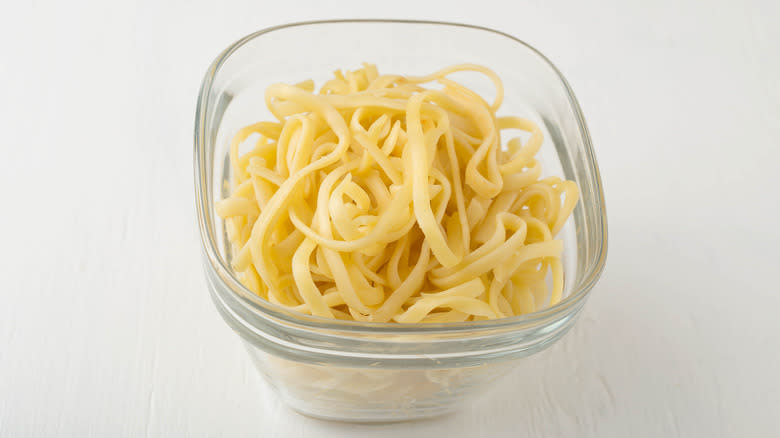 glass container with leftover pasta noodles