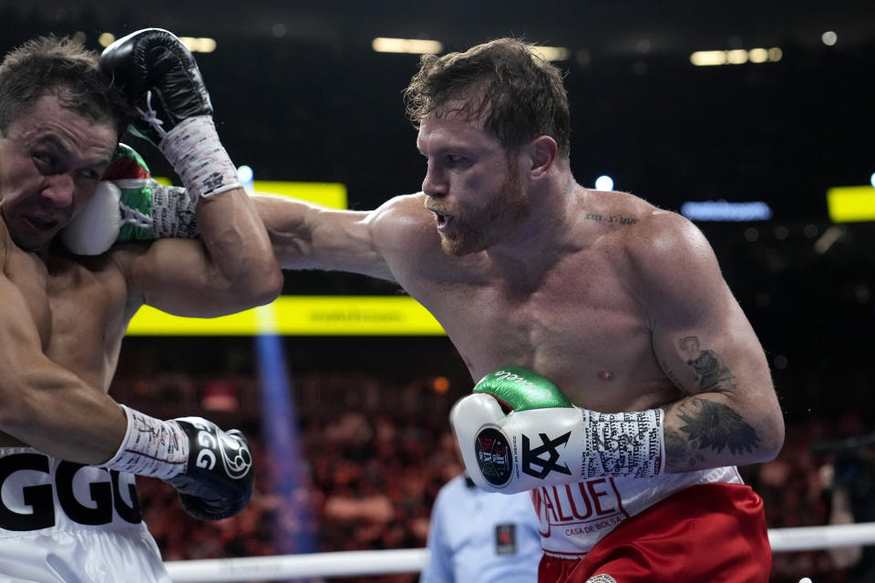 Canelo Alvarez, right, fights Gennady Golovkin in a super middleweight title boxing match, Saturday, Sept. 17, 2022, in Las Vegas. (AP Photo/John Locher)