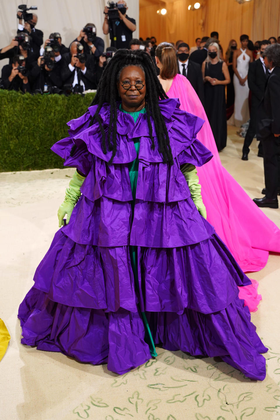 at the met gala in a purple tier dress