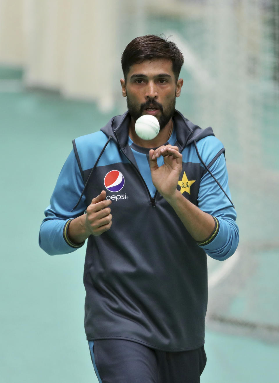 Pakistan's Mohammad Amir prepares to bowl during an indoor training session ahead of their Cricket World Cup match against India at Old Trafford in Manchester, England, Saturday, June 15, 2019. (AP Photo/Aijaz Rahi)