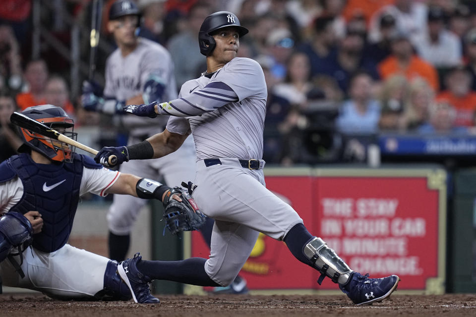New York Yankees' Juan Soto hits an RBI single during the fifth inning of a baseball game against the Houston Astros, Thursday, March 28, 2024, in Houston. (AP Photo/Kevin M. Cox)