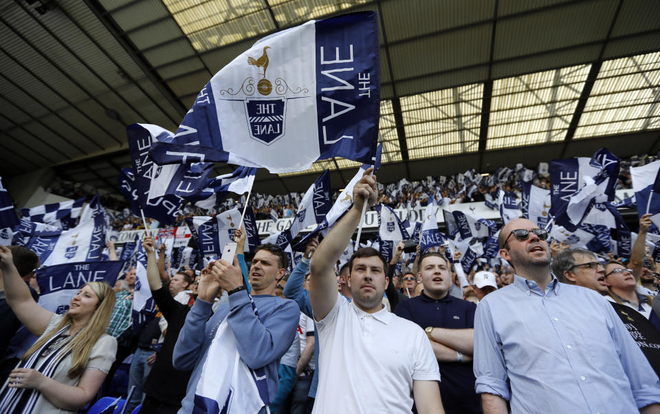 Tottenham fans wave flags ahead of an English Premier League soccer match against Manchester United last year. (AP)