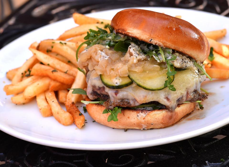 Passerelle Bistro in downtown Greenville will feature new items on their menu this Spring. This is a Bistro Burger: caramelized onions, bonemarrow, rosemary aioli, house dill pickles, gruyere, arugula, on a brioche bun with fries.