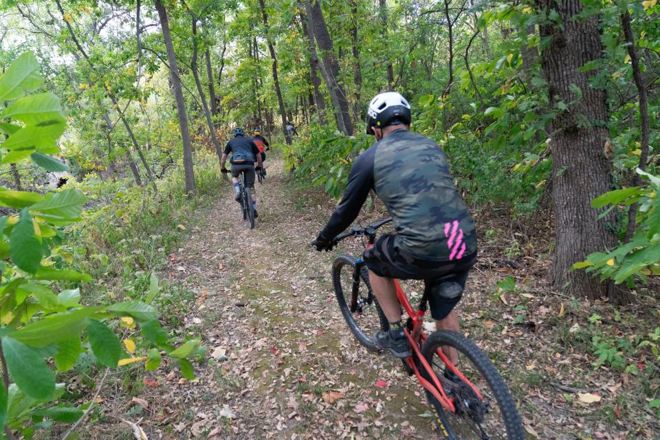 Mountain bikers with Top City Trails Alliance tackle portions of the yellow trails at Dornwood Nature Trails during a recent group ride.