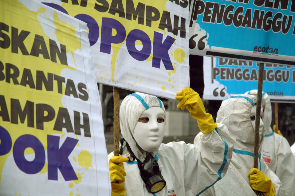 Environmental activists carry banners that read, "Free the Brantas River from diaper waste" in Jakarta, Indonesia, on Jan. 18, 2018. (NurPhoto via Getty Images)