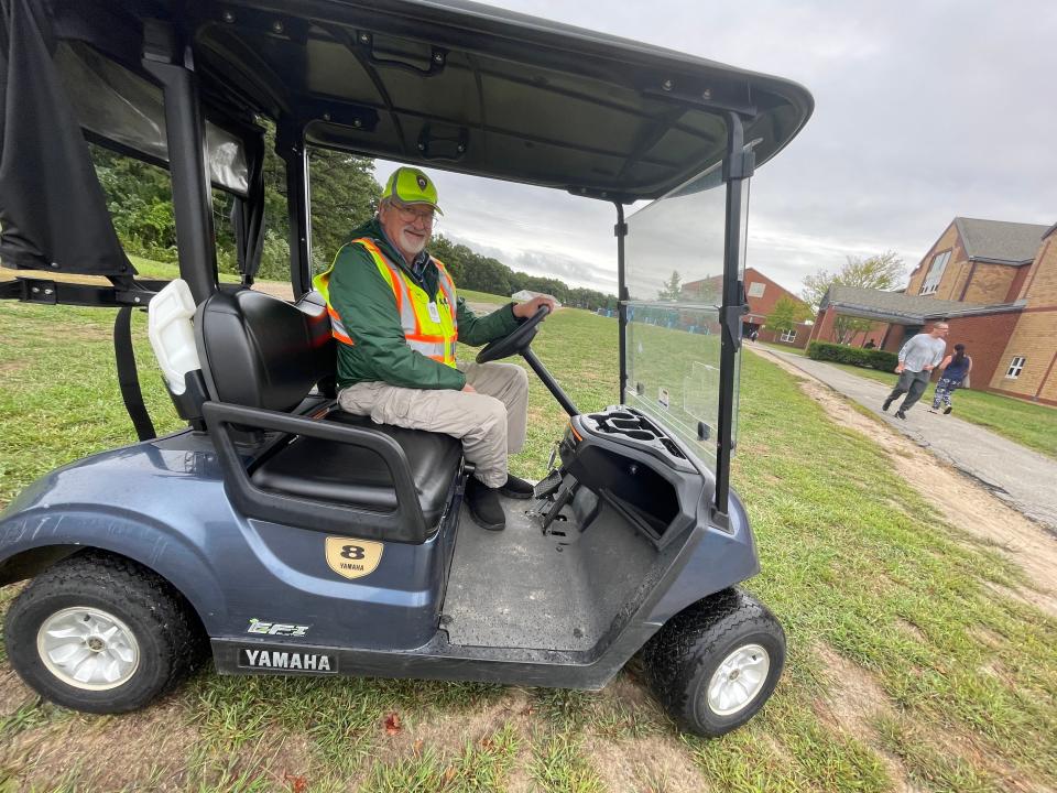 Christopher Ranney ready to offer a lift to voters with mobility challenges at the polls in Sandwich's Oak Ridge Elementary School.