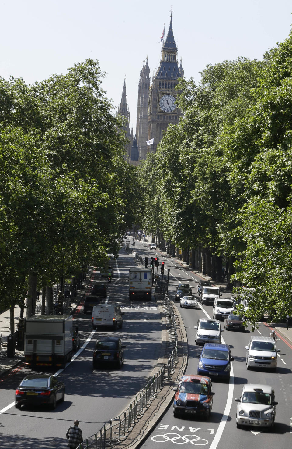 Traffic drives along Olympic Lanes on Embankment in central London, Monday, July 23, 2012. The Olympic road lanes will come into effect on Wednesday, July 25, two days before the Opening Ceremony of the 2012 Summer Olympics. Only accredited vehicles will be allowed to use them. London's traditional Black Cabs will not be allowed in them. (AP Photo/Kirsty Wigglesworth)