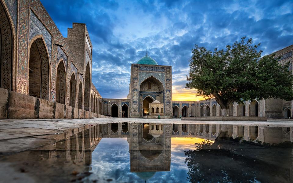 Kalyan Mosque at dusk in Bukhara, Uzbekistan - Getty