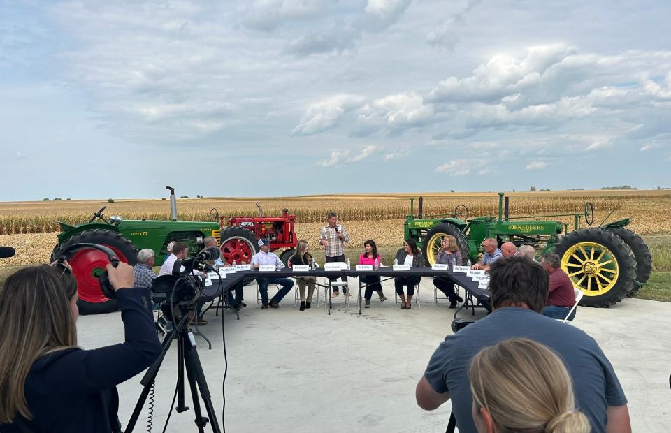 Dennis Campbell (middle), a sixth-generation Iowa farmer who runs Crystal Creek Enterprises in Grand Mound, introduces Republican presidential candidate Nikki Haley Friday during a roundtable event with community stakeholders.