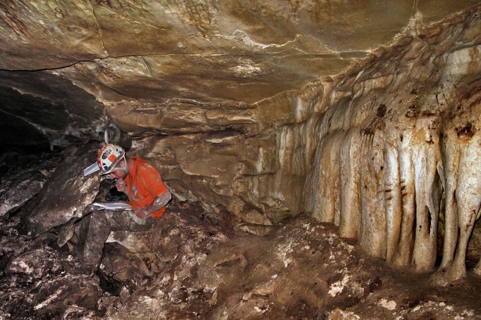 Israeli cave researcher Boaz Langford mapping a cave August 2, 2009 in the Judean Hills, Israel, where 120 gold, silver and bronze coins were found.