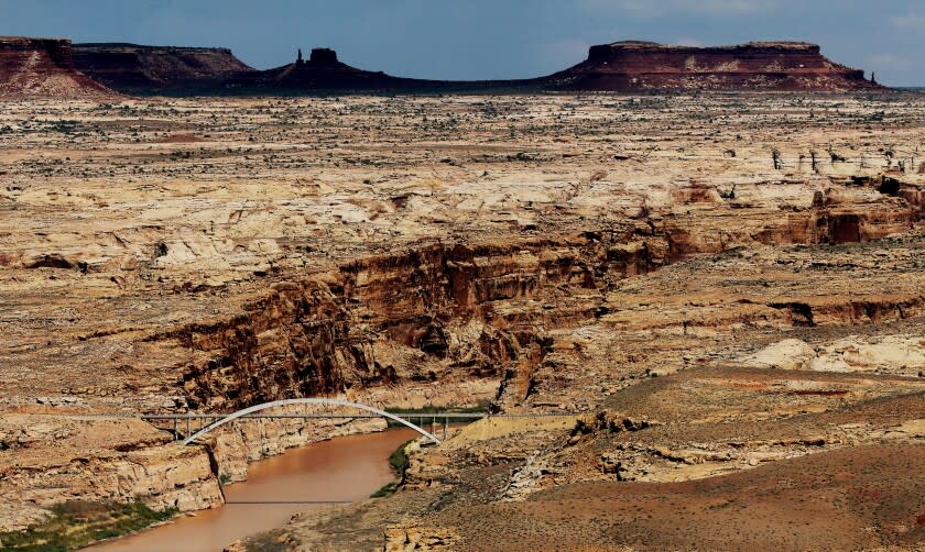 BLANDING, UTAH - MAY 16, 2022. The Hite Crossing Bridge spans over the Colorado River in Southern Utah, near the confluence with the Dirty Devil River. The location marks the northern limit of Lake Powell, a vast reservoir of Colorado River water created by the construction of the Glen Canyon Dam. The surrounding ecosystem typifies the vast and arid ecosystem of the Colorado Plateau, through which the river flows. (Luis Sinco / Los Angeles Times)