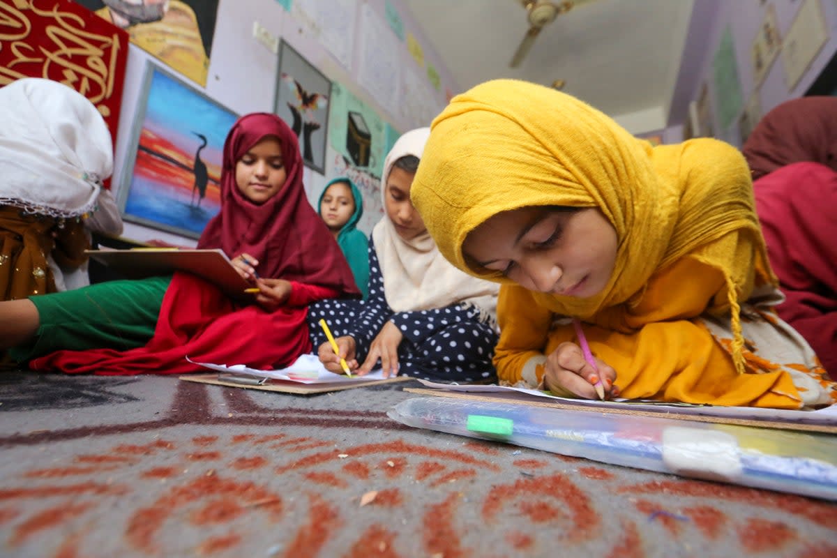 Afghan orphan girls attend a class in Jalalabad last month  (AFP/Getty)