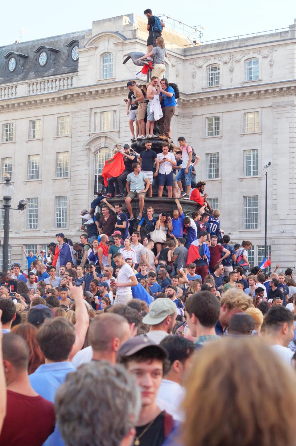 France fans take over London’s Eros statue…