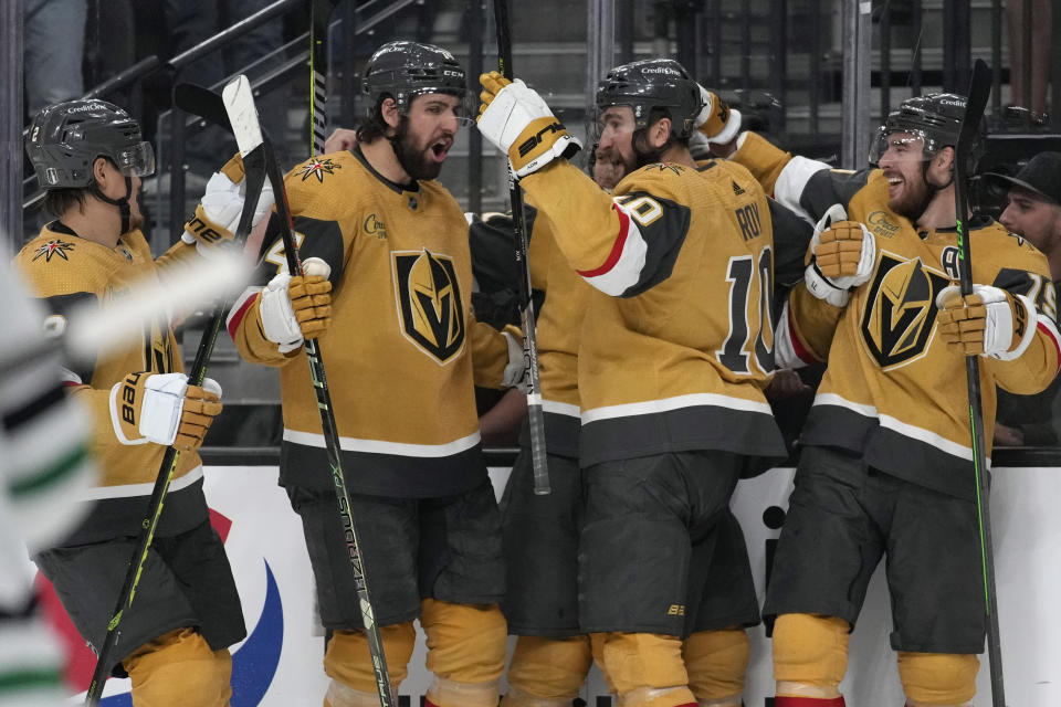 Vegas Golden Knights celebrate after Vegas Golden Knights center William Karlsson, center, scored against the Dallas Stars during the second period of Game 1 of the NHL hockey Stanley Cup Western Conference finals Friday, May 19, 2023, in Las Vegas. (AP Photo/John Locher)