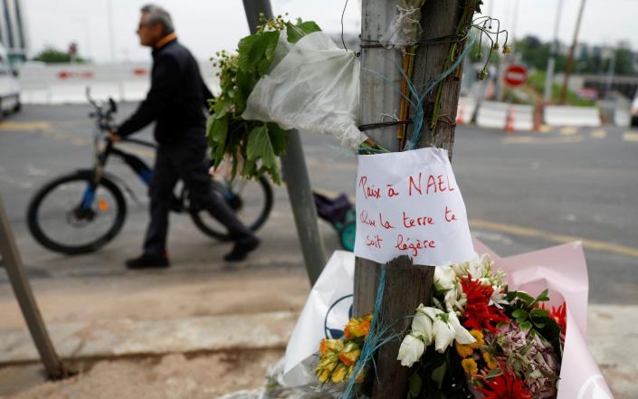 Flowers at the site in Nanterre where Nahel Merzouk was killed