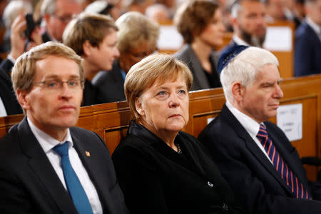 German Chancellor Angela Merkel attends a ceremony marking the 80th anniversary of Kristallnacht, also known as the Night of Broken Glass, at Rykestrasse Synagogue, in Berlin, Germany, November 9, 2018. REUTERS/Fabrizio Bensch
