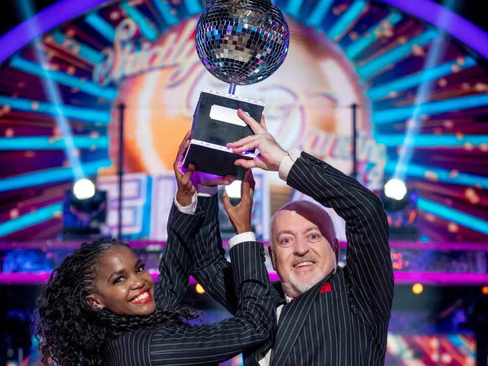 <p>‘It served as an inspiring, welcome surprise at a time of unwelcome shocks’: Oti Mabuse and Bill Bailey celebrate their ‘Strictly Come Dancing’ triumph</p> (BBC/Guy Levy)