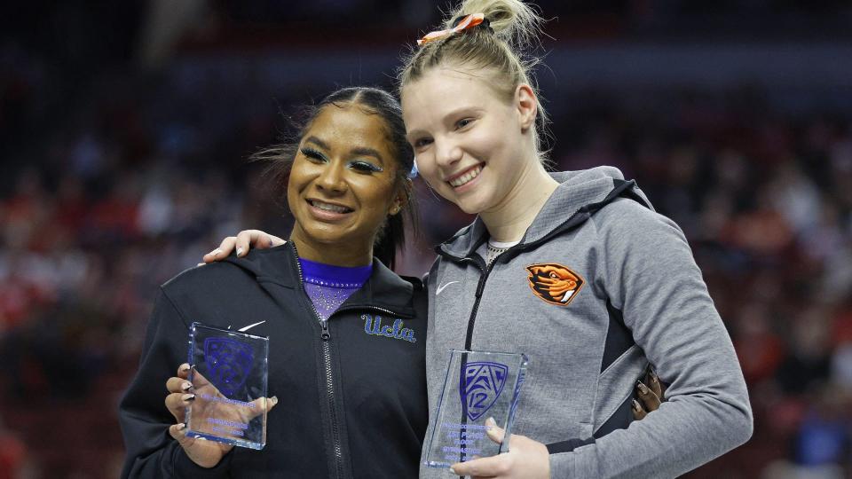 UCLA’s Jordan Chiles, left, and Oregon State’s Jade Carey share the floor event title during the Pac-12 Women's Gymnastics Championship at Maverik Center.