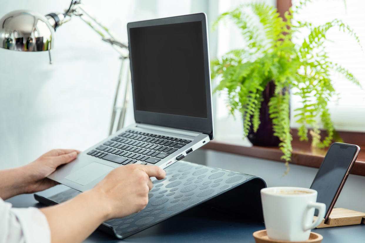 Keep your screen elevated to improve posture and keep your workspace neat and tidy