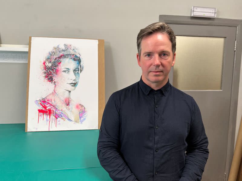 British artist Carne Griffiths poses with his work "The Platinum Queen" in London